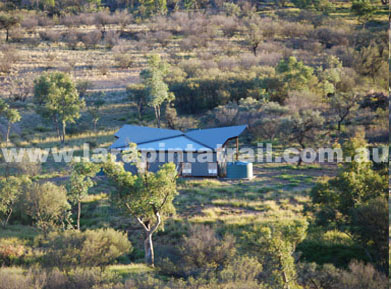 View of the trailhead from the nearby high ground. Flat open area